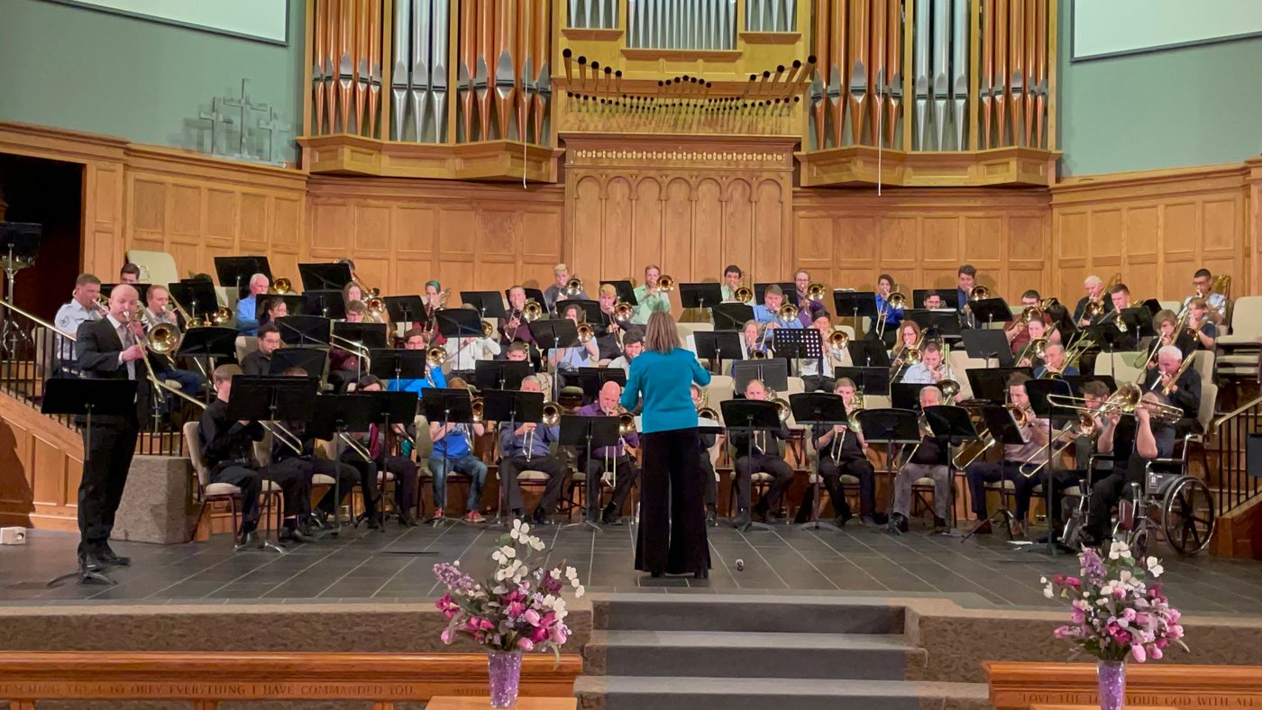 Dr. Sondra Bell conducting the festival mass trombone choir in 2022