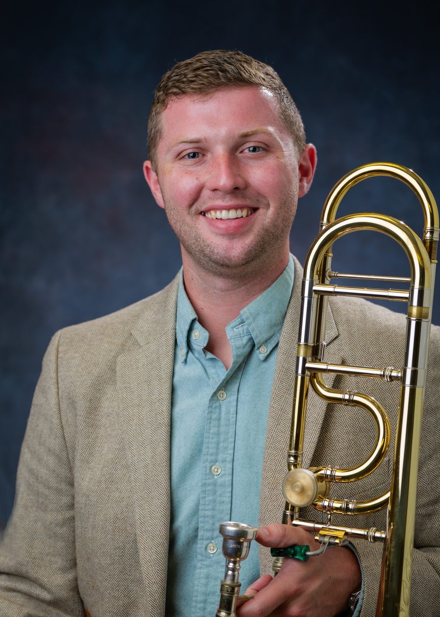 Dr. Sterling Tanner holding his trombone